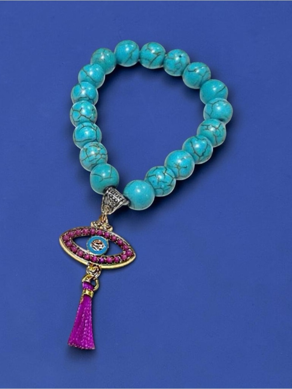 Turquoise bracelet with purple Evil Eye